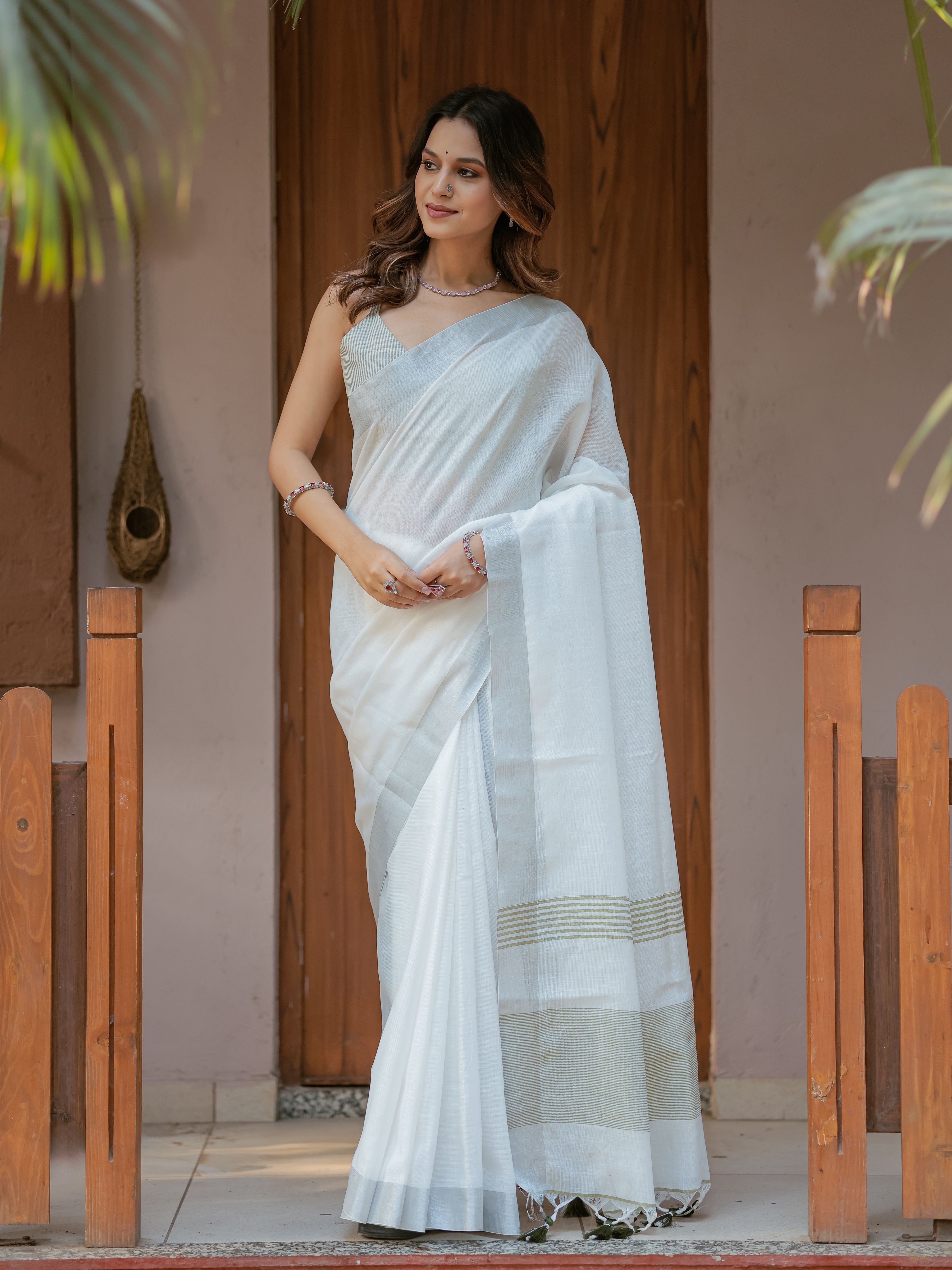 Pure White & Olive Green Handloom Cotton Saree with Minimal Striped Border & Tassel Detailing