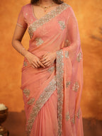 Peach Pink Fendy Satin Embroidered Saree with Rich Floral Border & Tassels | Elegant Pastel Designer Saree with Heavy Embroidered Blouse