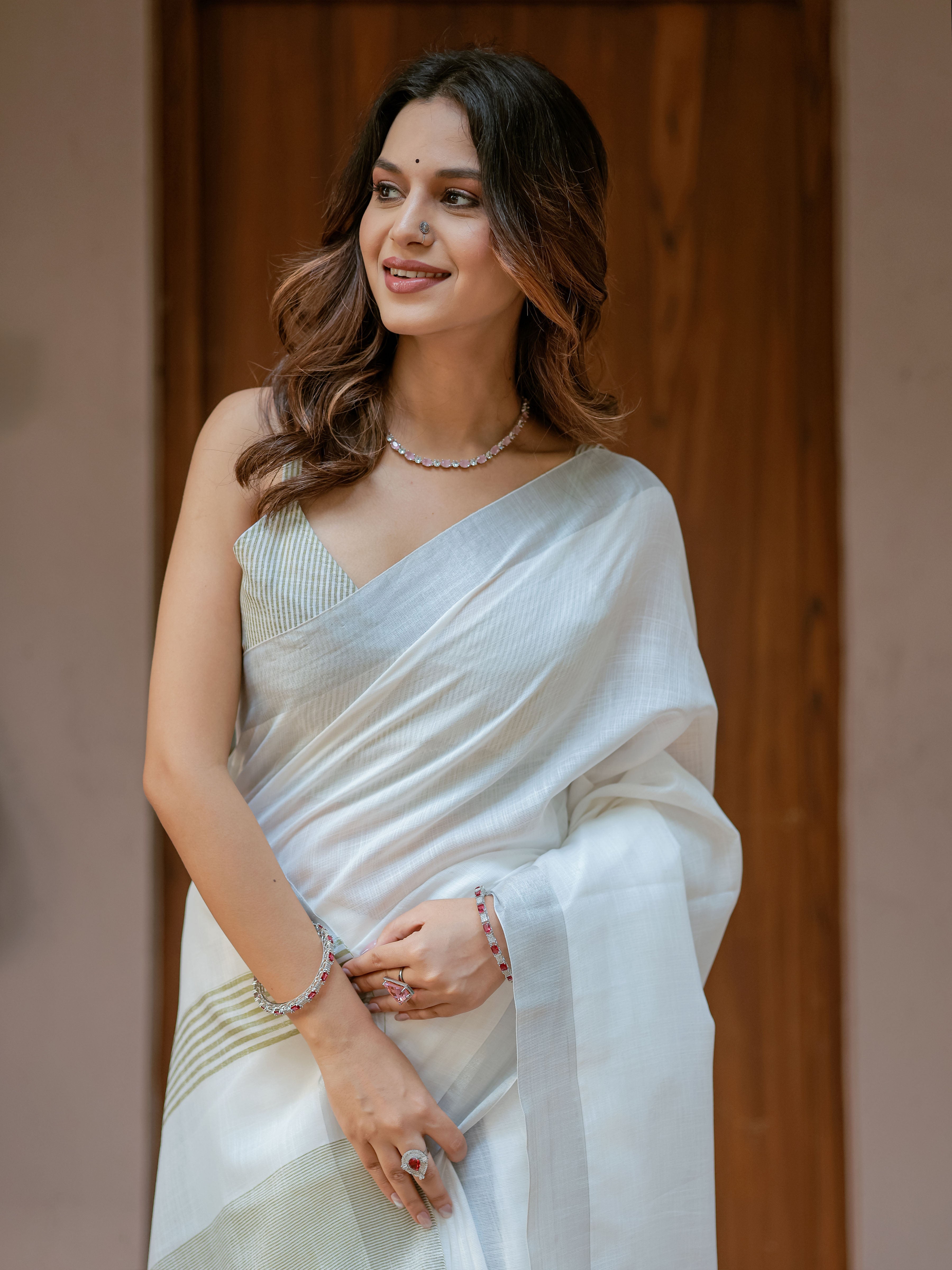 Pure White & Olive Green Handloom Cotton Saree with Minimal Striped Border & Tassel Detailing