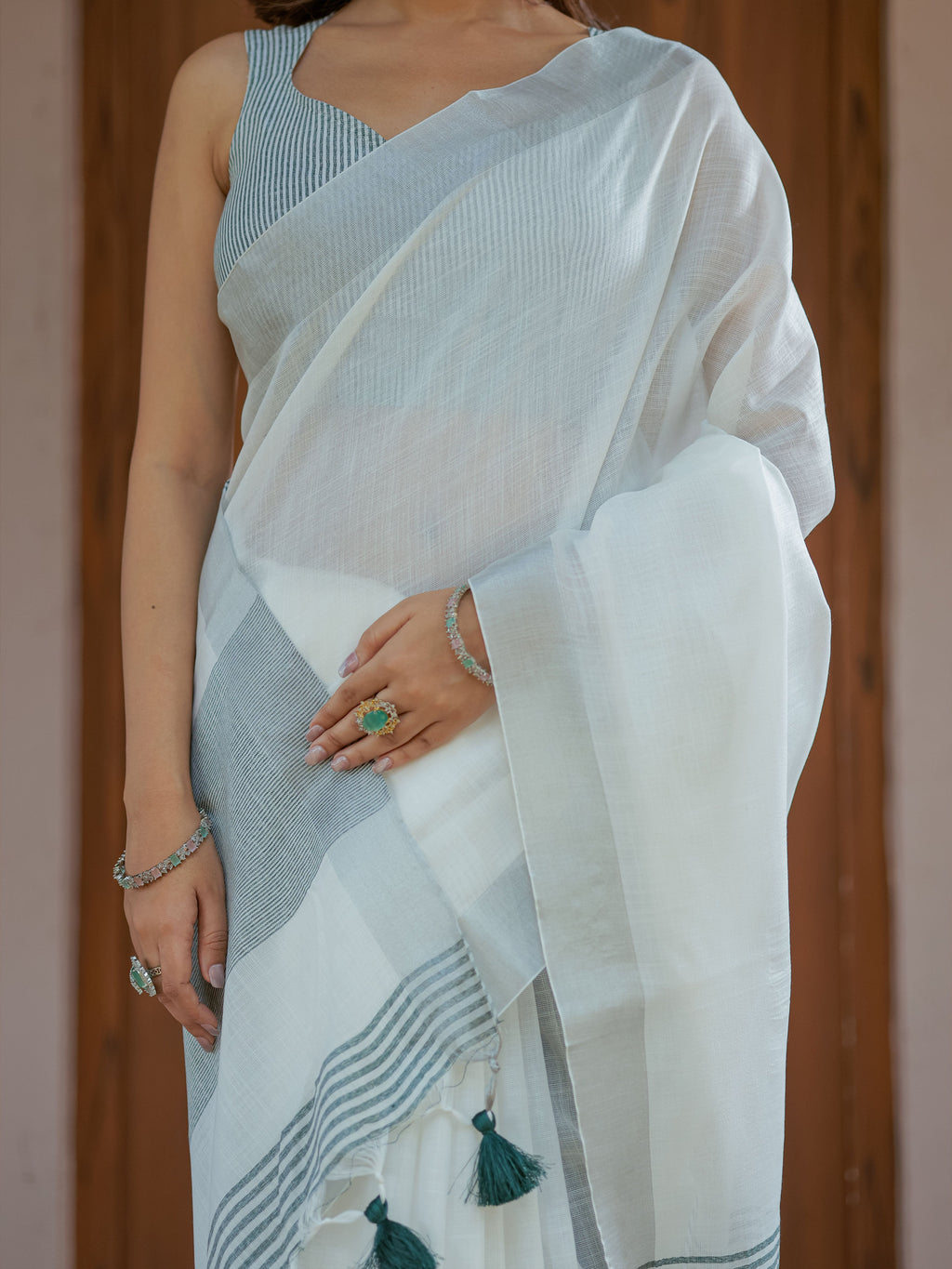 Pure White & Teal Blue Handloom Cotton Saree with Minimal Striped Border & Tassel Detailing