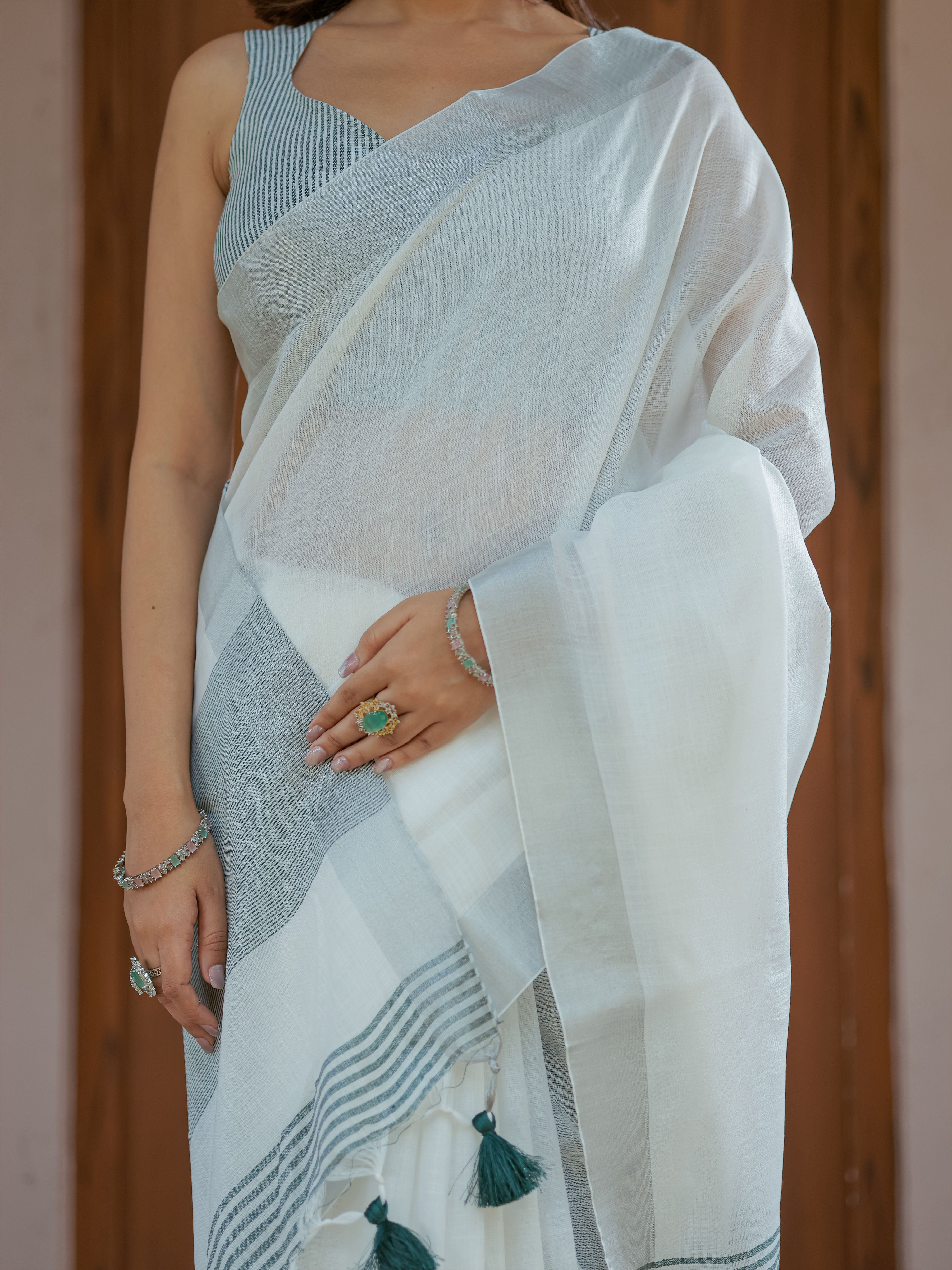 Pure White & Teal Blue Handloom Cotton Saree with Minimal Striped Border & Tassel Detailing