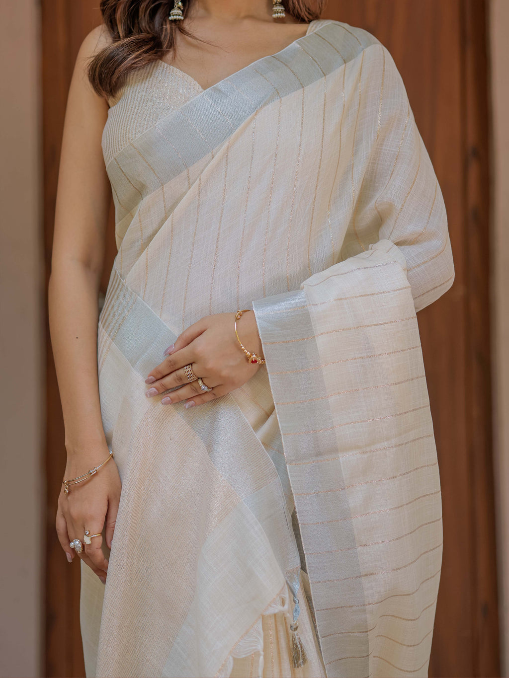 Ivory Cream Pure Handloom Cotton Saree with Golden Striped Weaving & Tassel Detailing