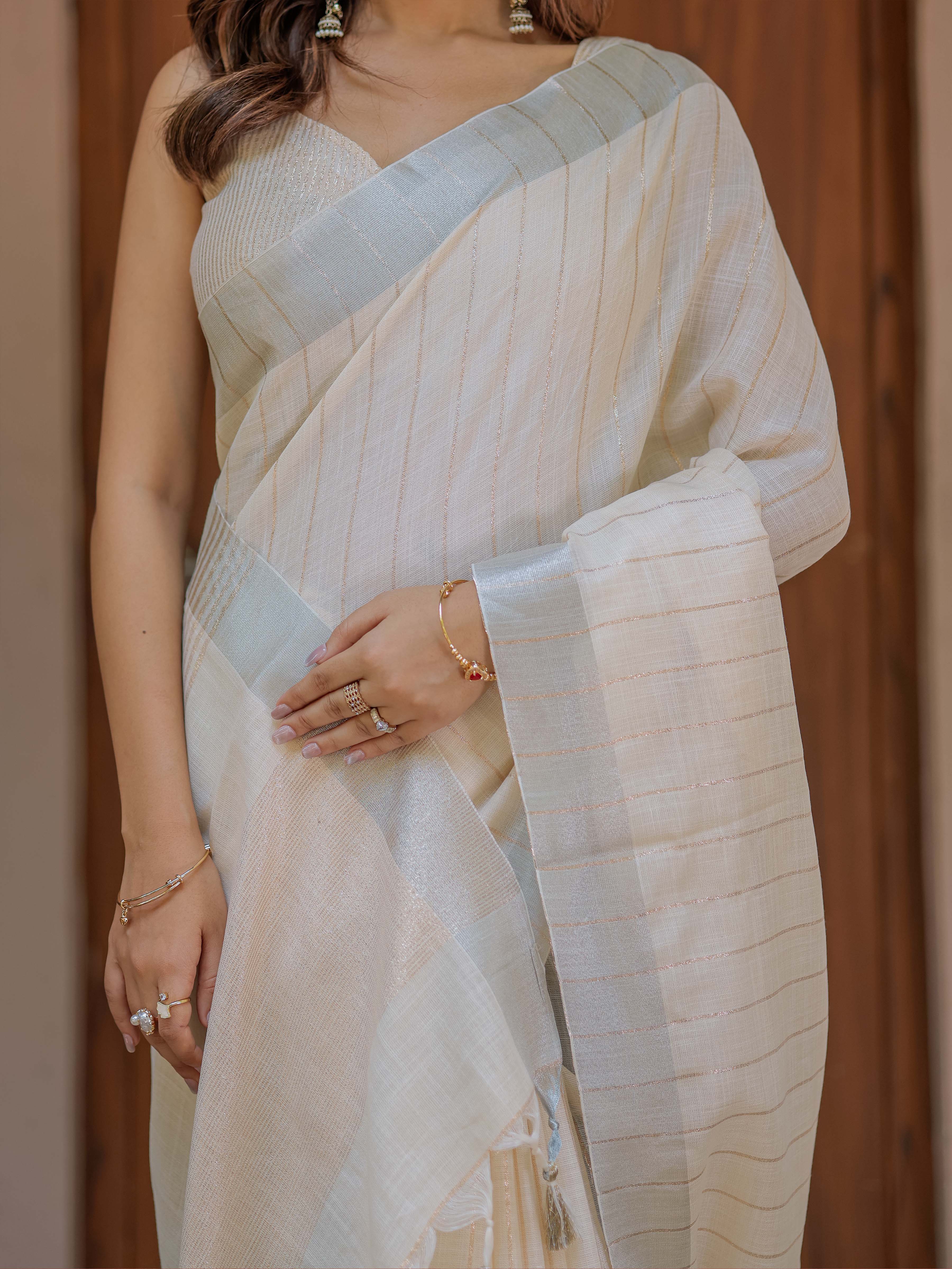 Ivory Cream Pure Handloom Cotton Saree with Golden Striped Weaving & Tassel Detailing