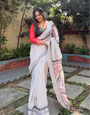 Elegant White Pure Linen Digital Printed Saree with Chevron Design and Intricate Red-Black Geometric Pallu – Tassel Details and Matching Blouse Piece