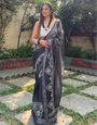 Black and White Pure Cotton Linen Saree with Intricate Floral Design and Tassels on Edges