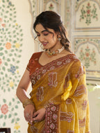 Mustard Yellow Fendy Satin Embroidered Saree with Ethnic Elephant Motifs & Contrast Zari Border | Designer Saree with Tassels & Heavy Embroidered Blouse