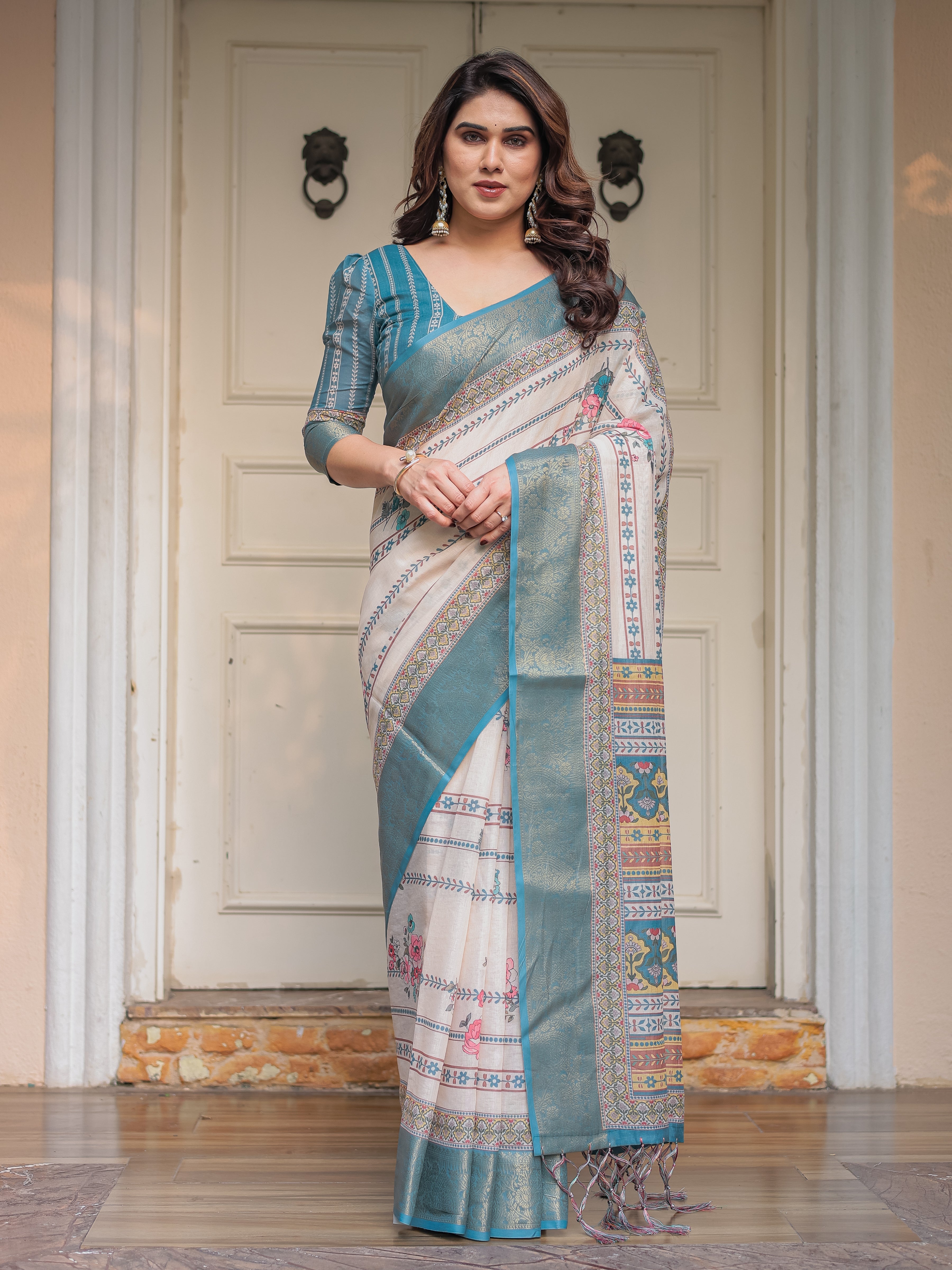 Off-White & Aqua Teal Traditional Printed Saree with Rich Zari Border & Tassels – Elegant Ethnic Festive Wear