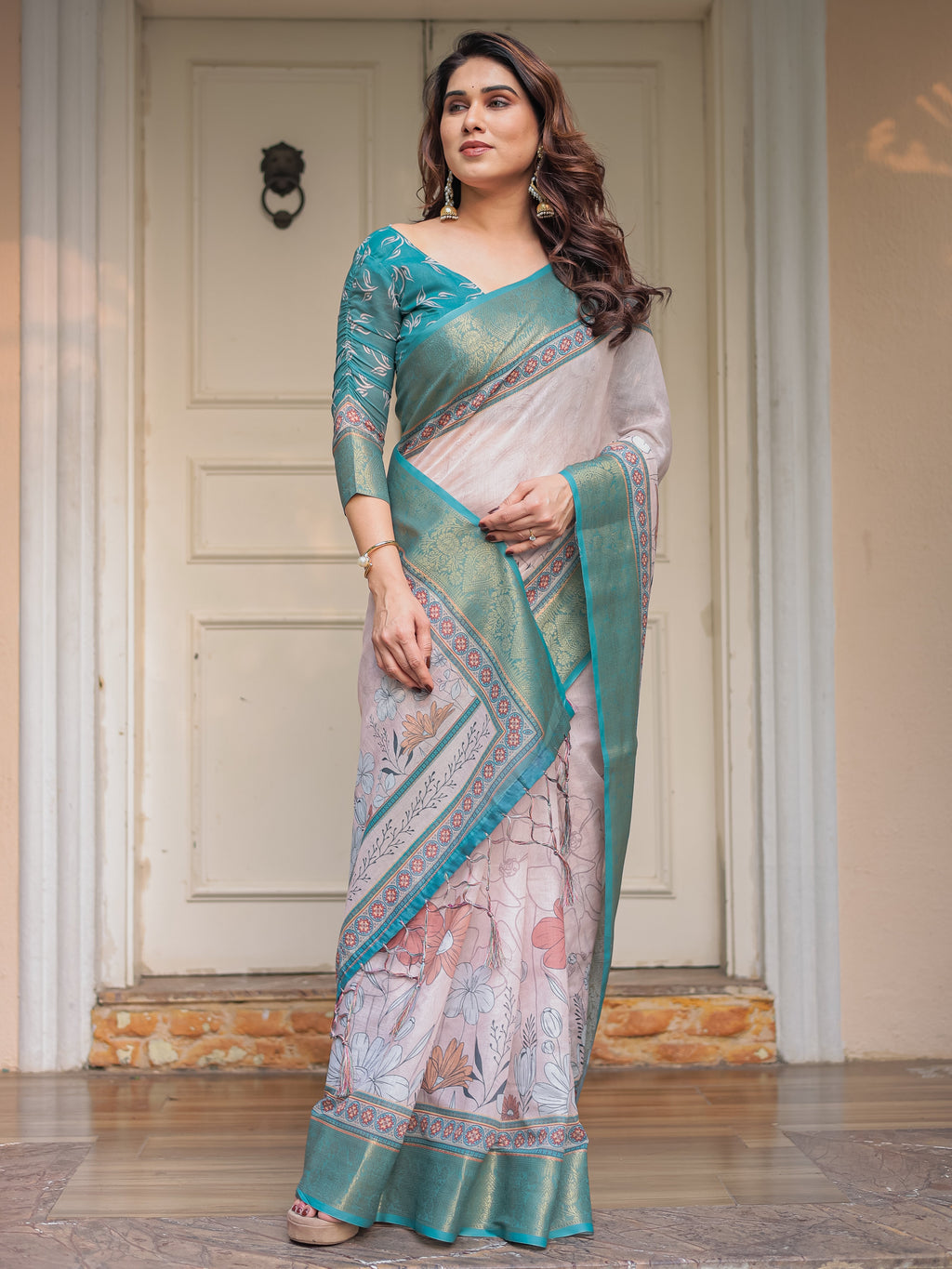 Pastel Lavender Floral Printed Saree with Teal Green Zari Border & Tassels – Elegant Festive Ethnic Wear