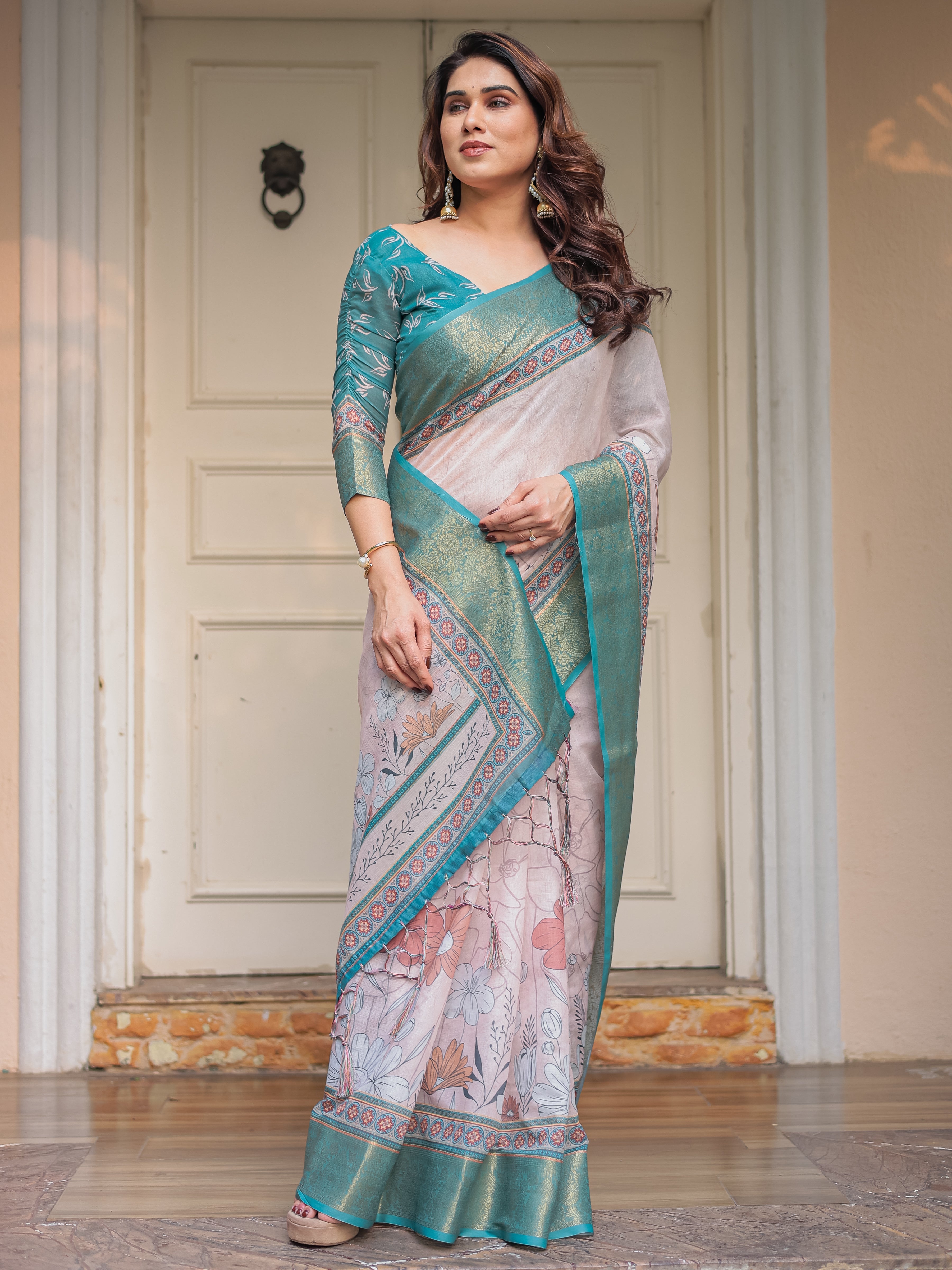 Pastel Lavender Floral Printed Saree with Teal Green Zari Border & Tassels – Elegant Festive Ethnic Wear