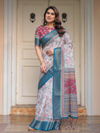 Ivory Floral Printed Saree with Rose Pink & Teal Blue Zari Border & Tassels – Elegant Festive Ethnic Wear