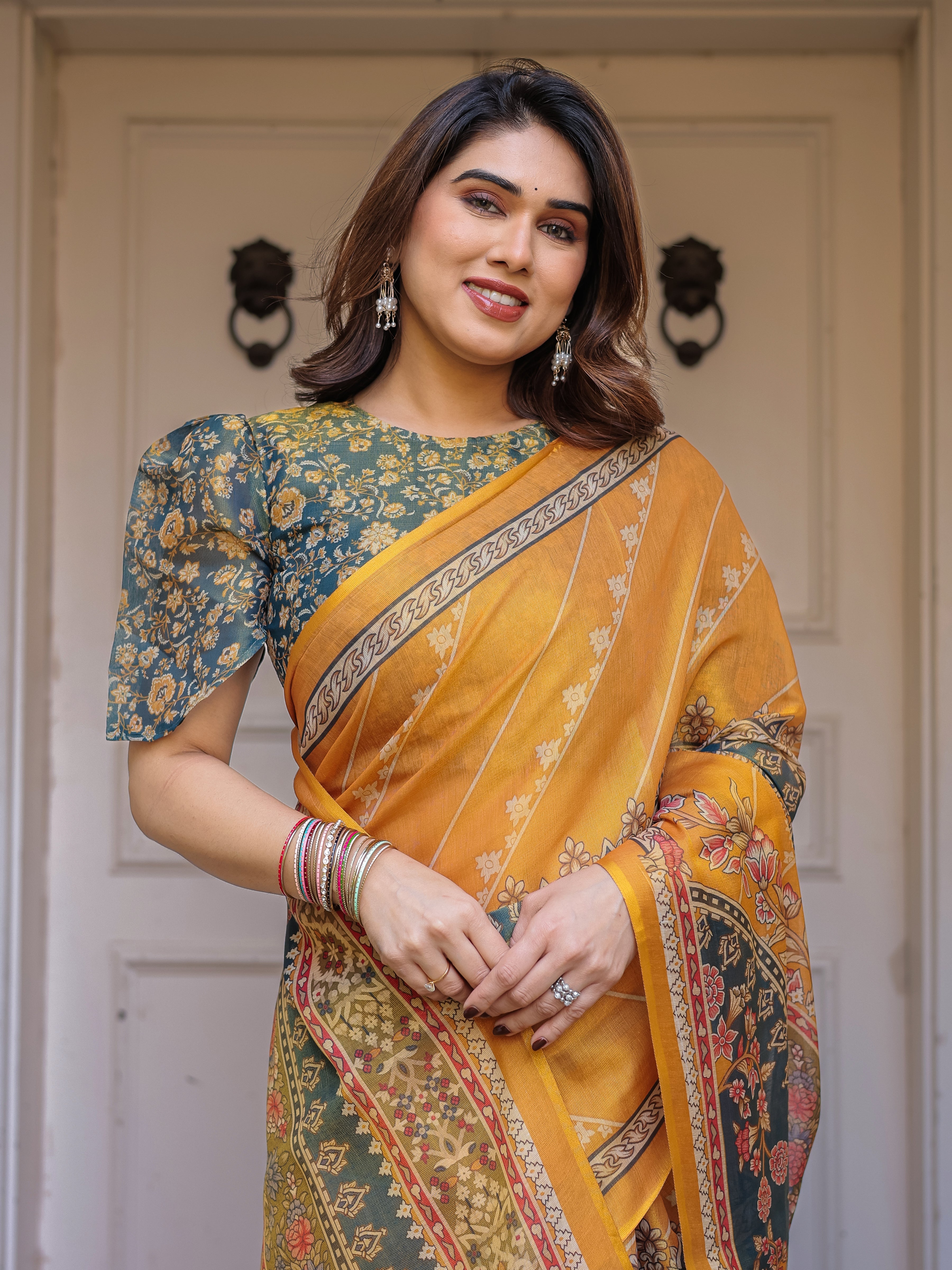 Mustard Yellow & Teal Green Floral Panel Printed Handloom Cotton Saree with Heritage Border & Tassels – Festive Traditional Wear