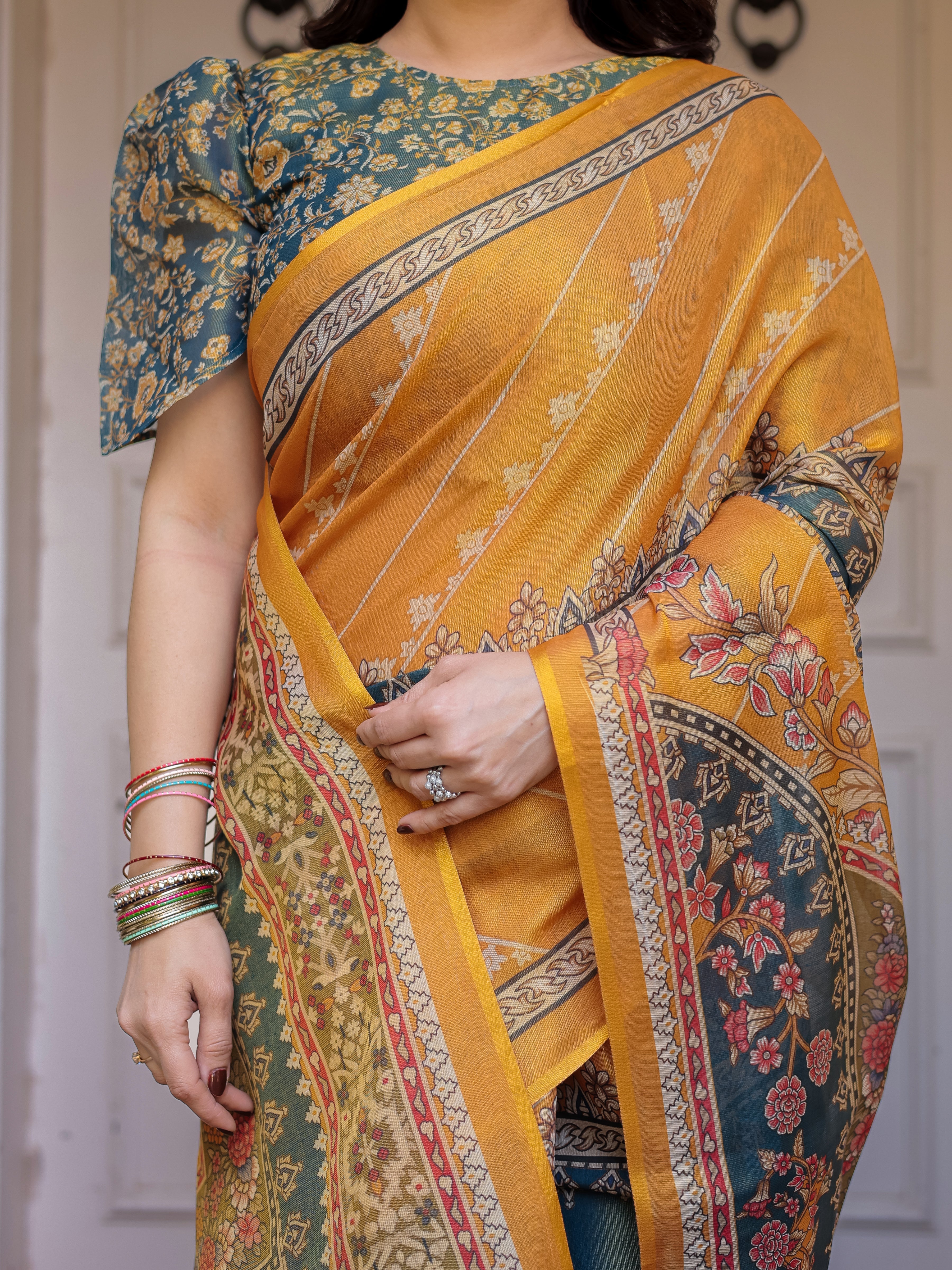 Mustard Yellow & Teal Green Floral Panel Printed Handloom Cotton Saree with Heritage Border & Tassels – Festive Traditional Wear