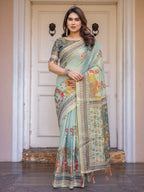 Mint Green Folk Printed Handloom Cotton Saree with Village Scene Panel Pallu, Ornamental Border & Tassels – Traditional Ethnic Wear