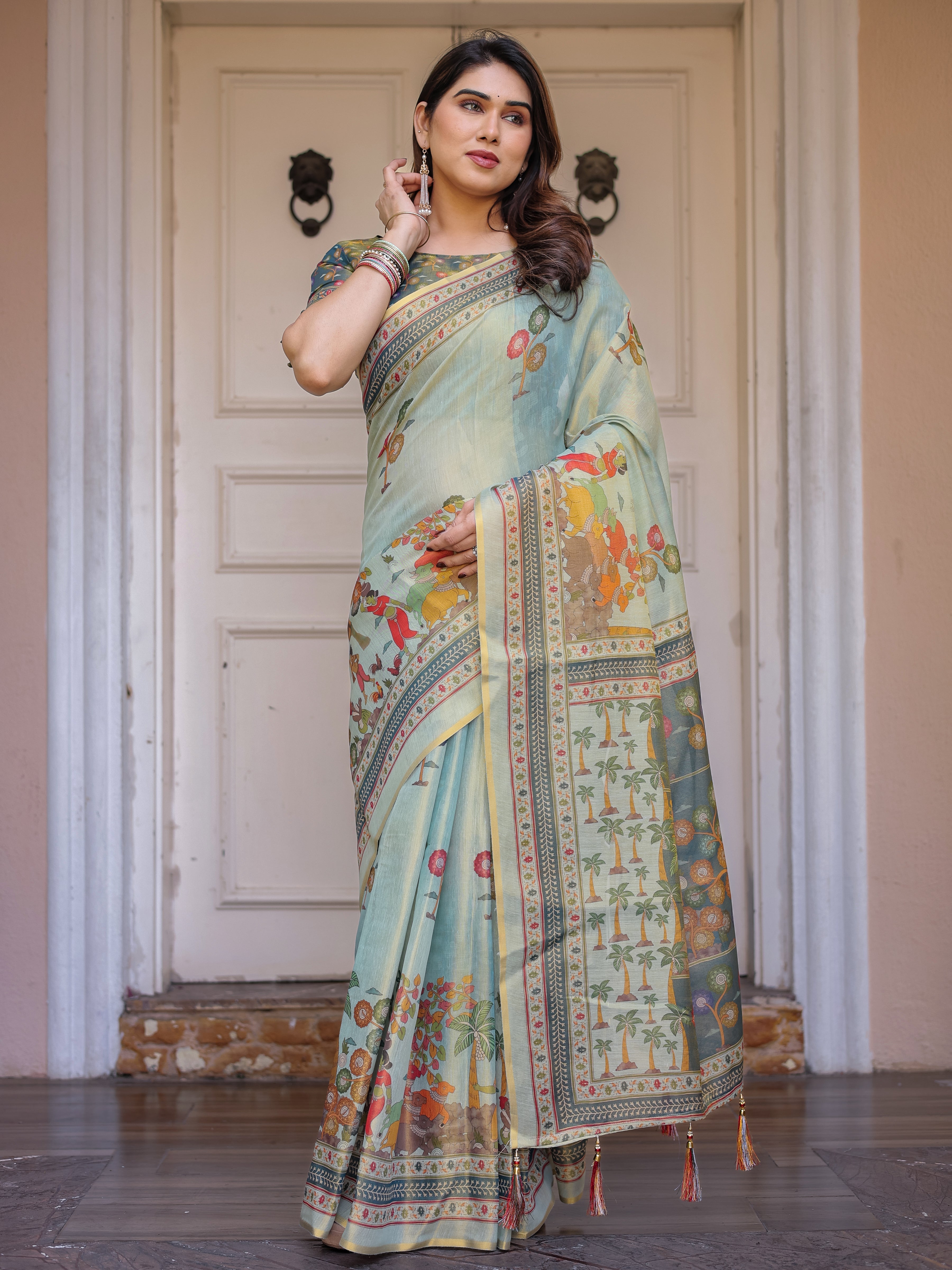Mint Green Folk Printed Handloom Cotton Saree with Village Scene Panel Pallu, Ornamental Border & Tassels – Traditional Ethnic Wear