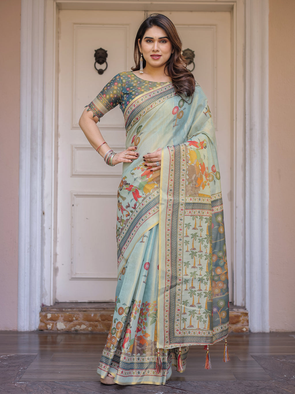 Mint Green Folk Printed Handloom Cotton Saree with Village Scene Panel Pallu, Ornamental Border & Tassels – Traditional Ethnic Wear