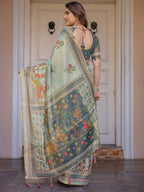 Mint Green Folk Printed Handloom Cotton Saree with Village Scene Panel Pallu, Ornamental Border & Tassels – Traditional Ethnic Wear