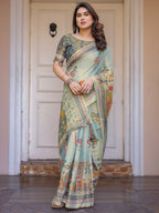 Mint Green Folk Printed Handloom Cotton Saree with Village Scene Panel Pallu, Ornamental Border & Tassels – Traditional Ethnic Wear