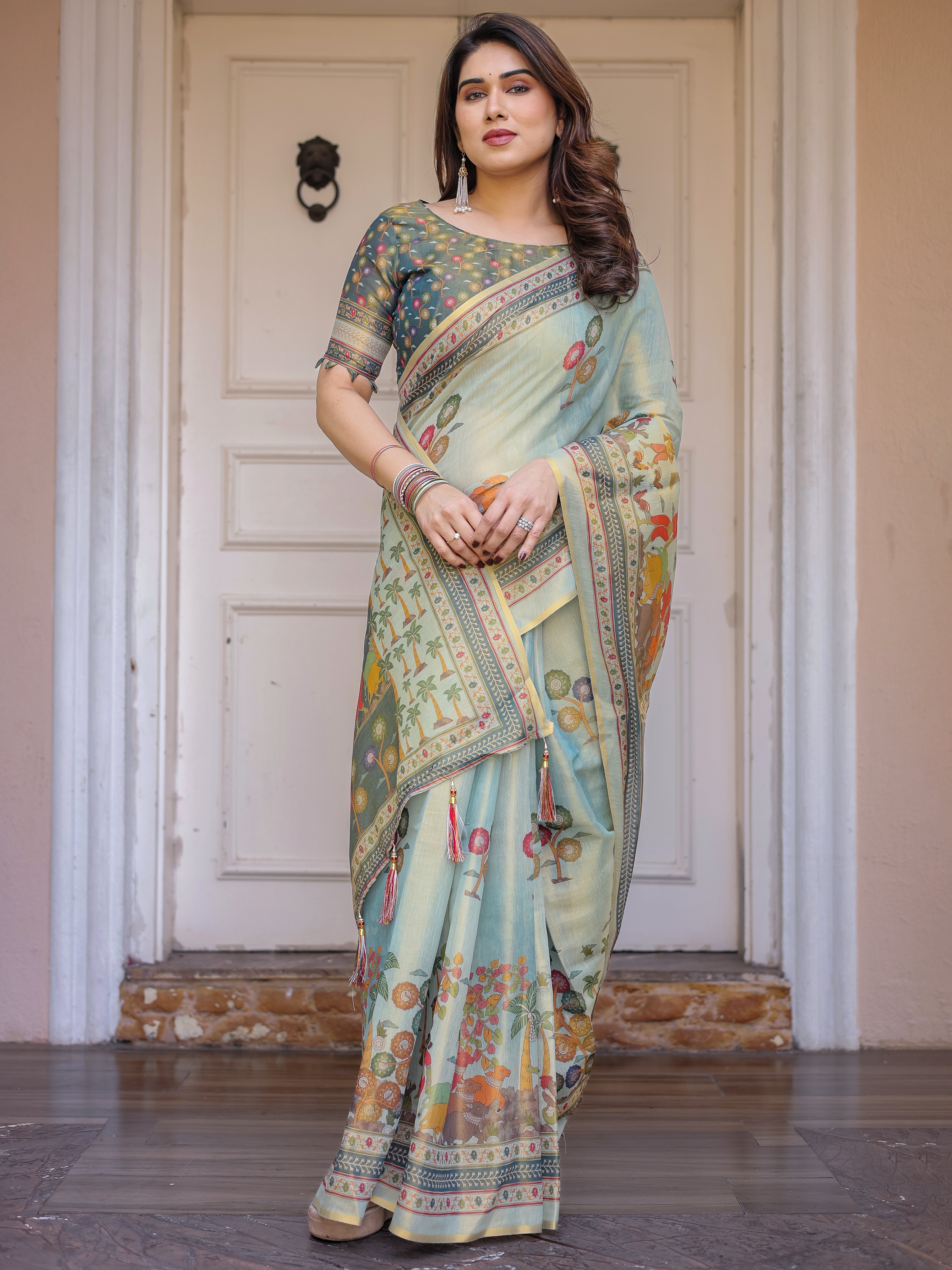 Mint Green Folk Printed Handloom Cotton Saree with Village Scene Panel Pallu, Ornamental Border & Tassels – Traditional Ethnic Wear