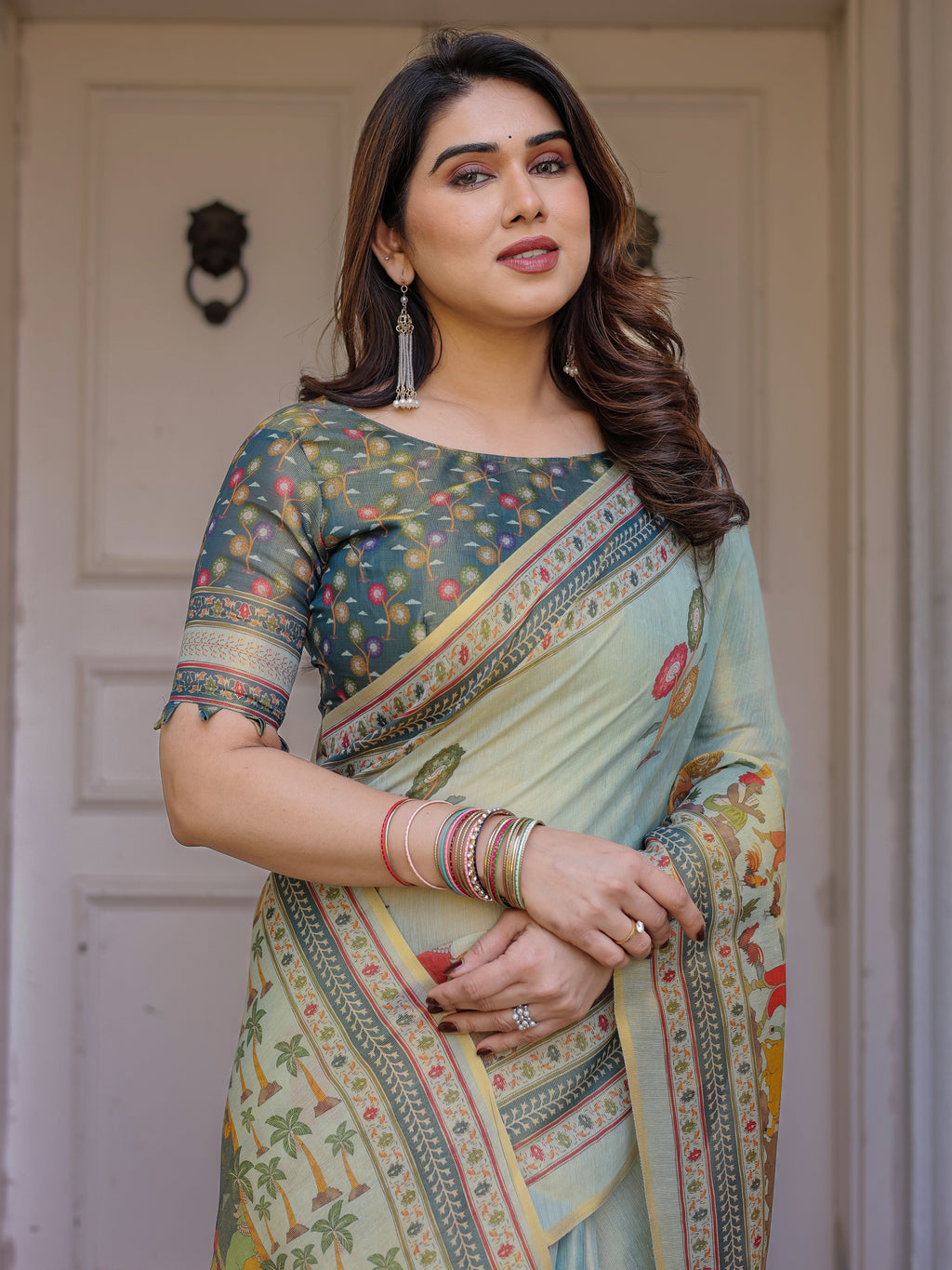 Mint Green Folk Printed Handloom Cotton Saree with Village Scene Panel Pallu, Ornamental Border & Tassels – Traditional Ethnic Wear