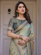 Mint Green Folk Printed Handloom Cotton Saree with Village Scene Panel Pallu, Ornamental Border & Tassels – Traditional Ethnic Wear