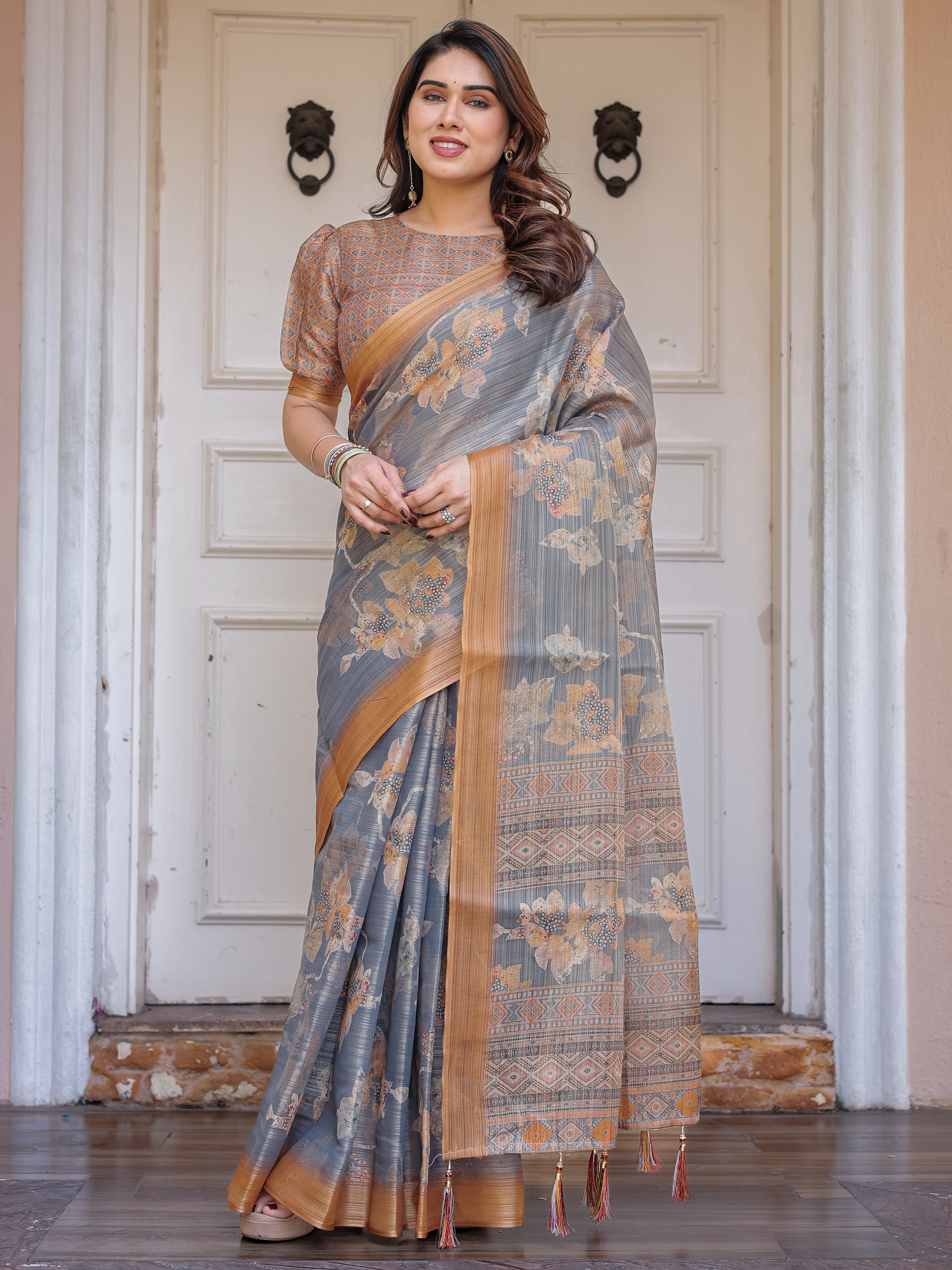 Steel Grey & Rust Gold Floral Handloom Cotton-Linen Saree with Zari Border & Tassels – Elegant Traditional Wear