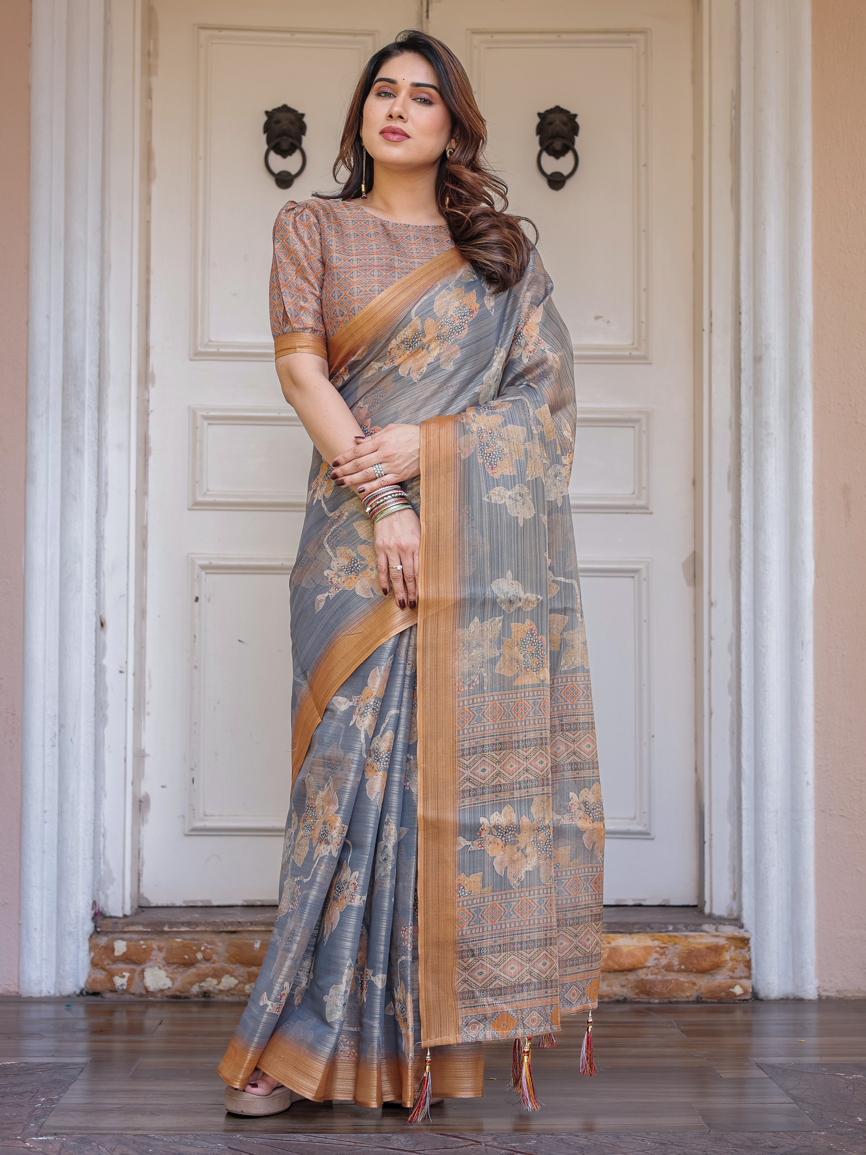 Steel Grey & Rust Gold Floral Handloom Cotton-Linen Saree with Zari Border & Tassels – Elegant Traditional Wear
