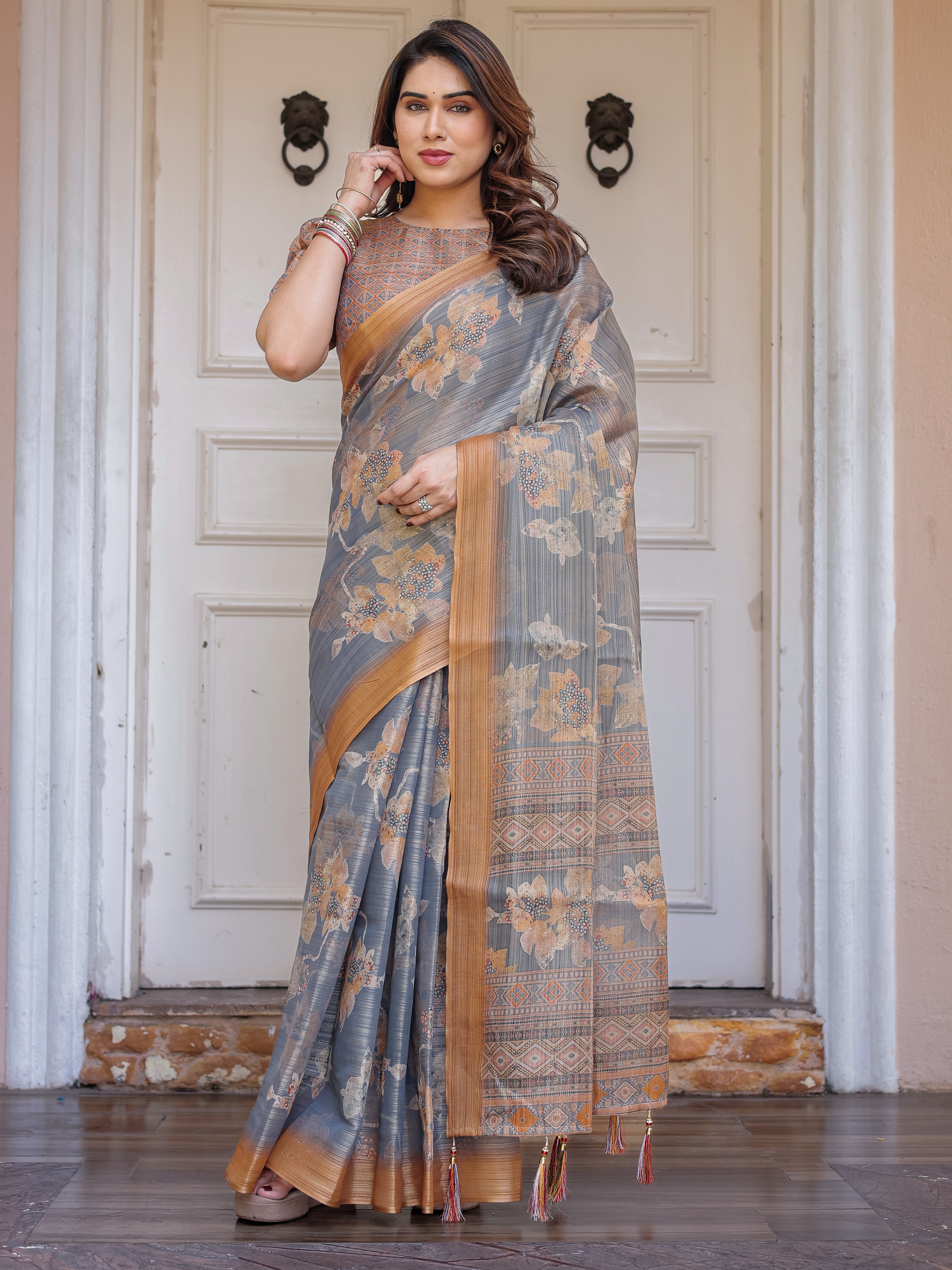 Steel Grey & Rust Gold Floral Handloom Cotton-Linen Saree with Zari Border & Tassels – Elegant Traditional Wear