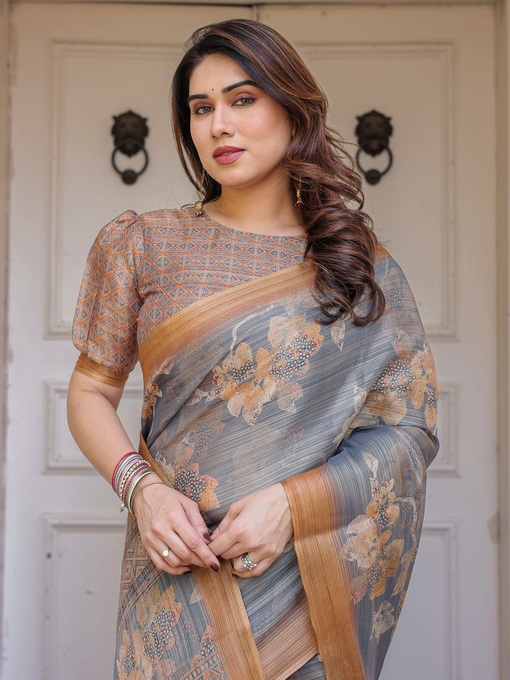 Steel Grey & Rust Gold Floral Handloom Cotton-Linen Saree with Zari Border & Tassels – Elegant Traditional Wear