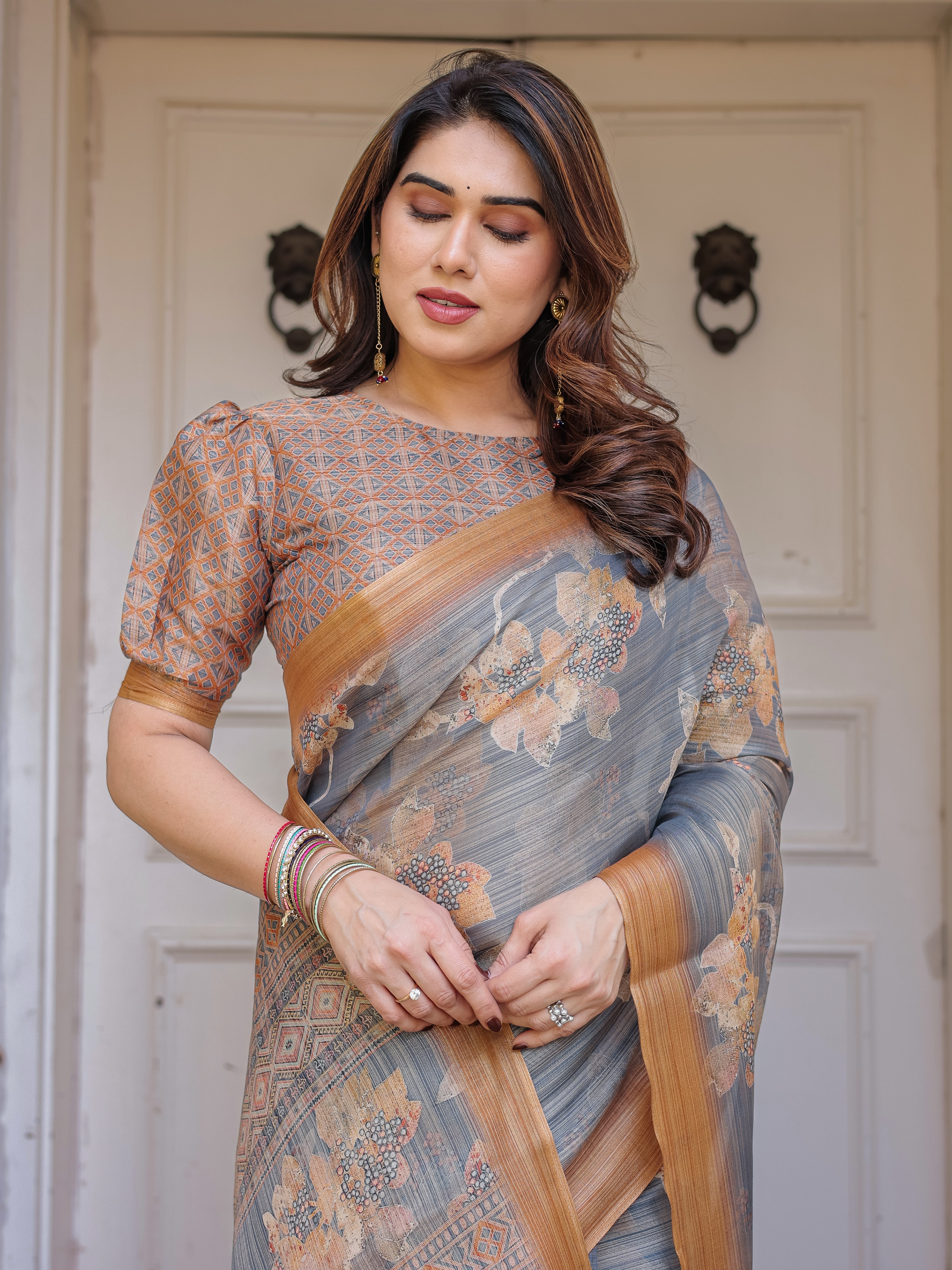 Steel Grey & Rust Gold Floral Handloom Cotton-Linen Saree with Zari Border & Tassels – Elegant Traditional Wear
