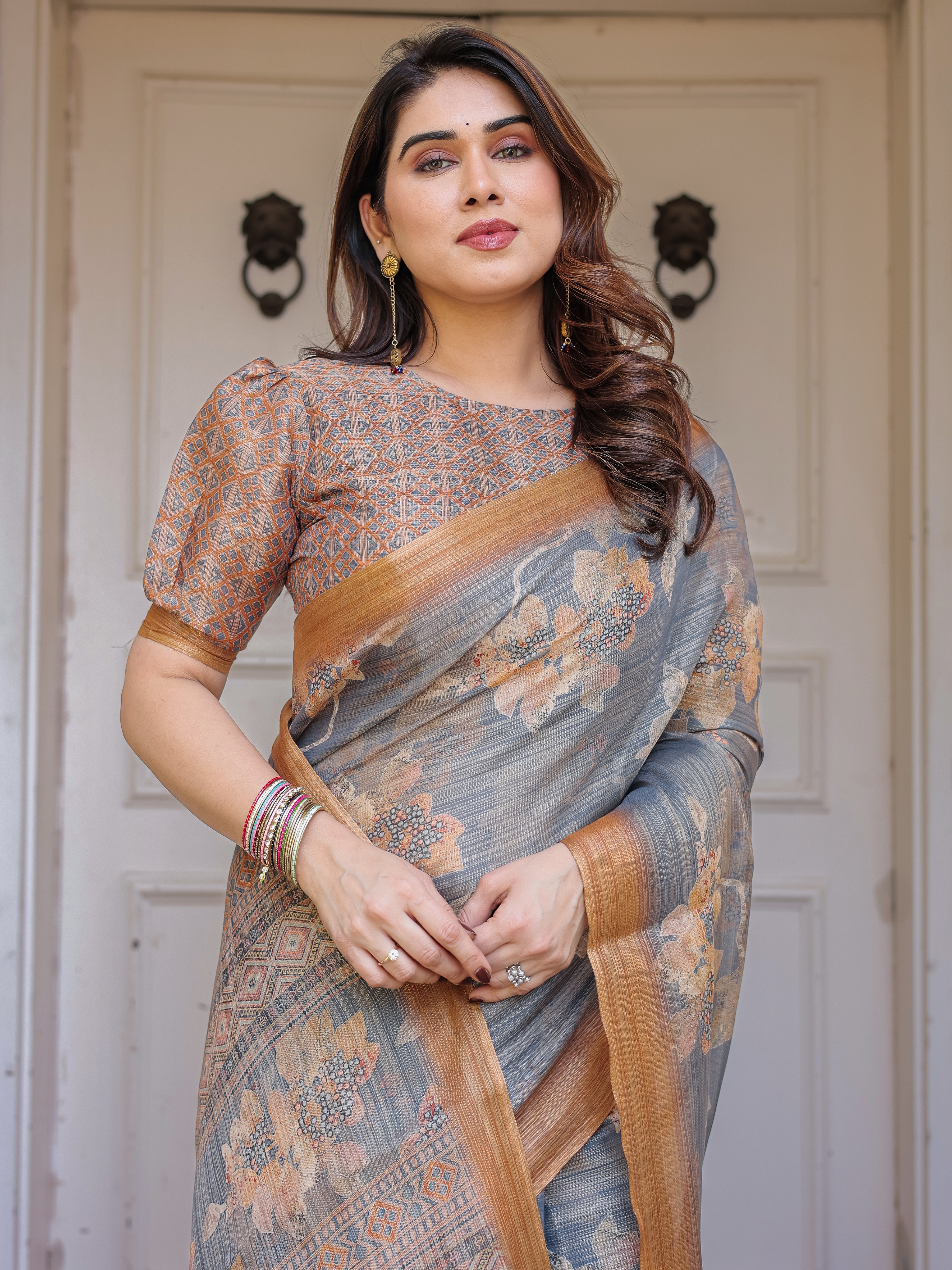 Steel Grey & Rust Gold Floral Handloom Cotton-Linen Saree with Zari Border & Tassels – Elegant Traditional Wear