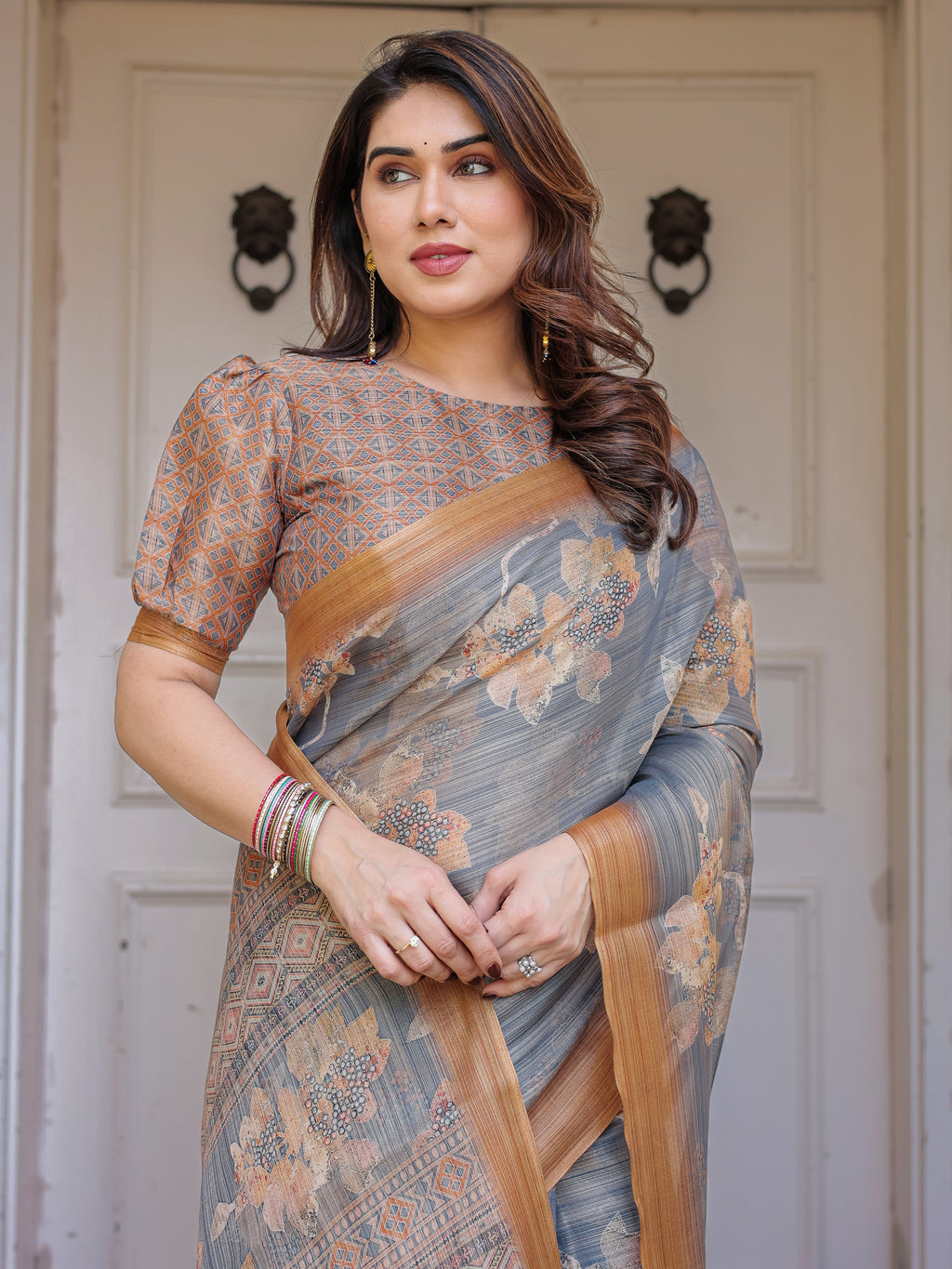 Steel Grey & Rust Gold Floral Handloom Cotton-Linen Saree with Zari Border & Tassels – Elegant Traditional Wear
