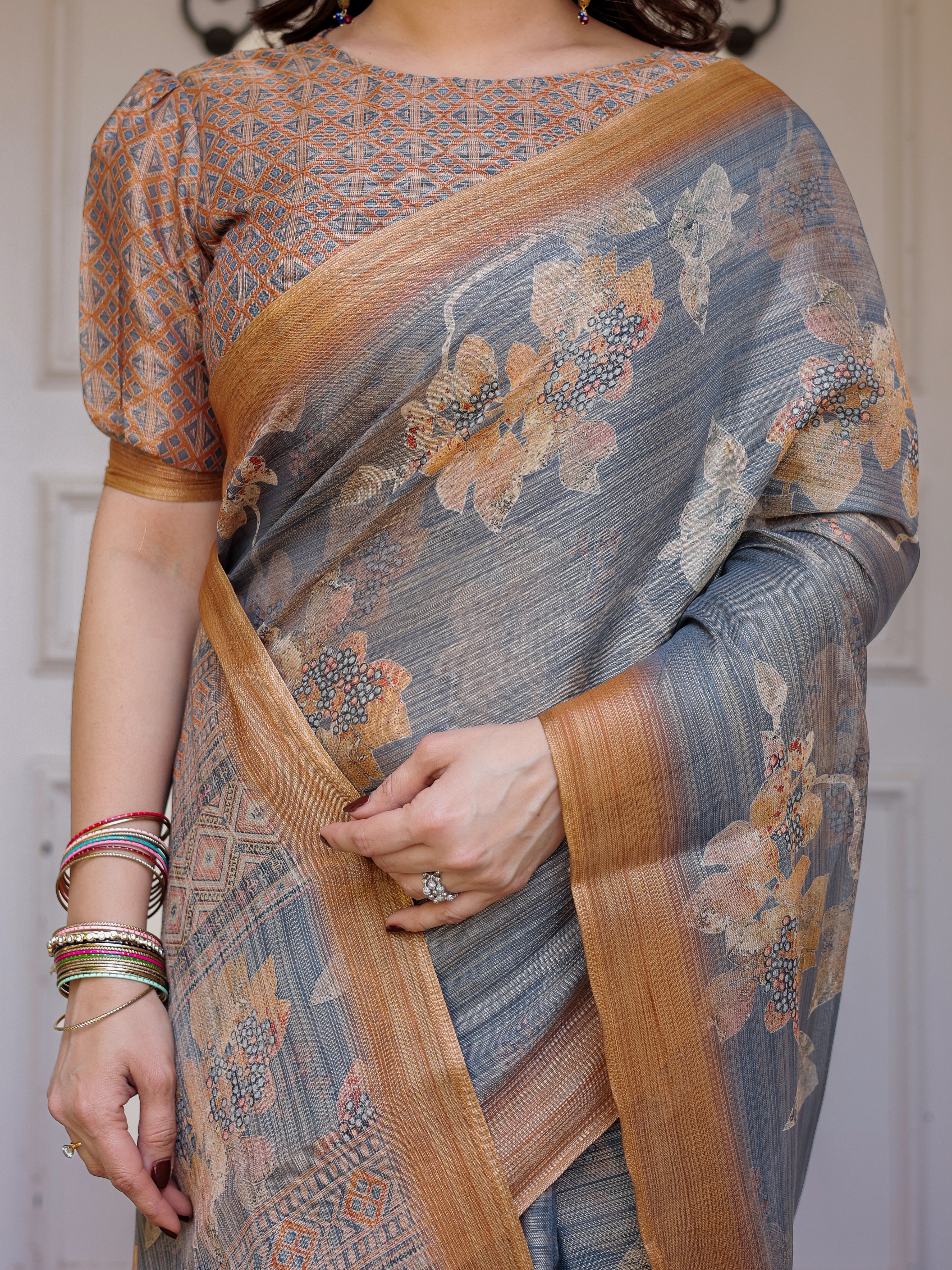 Steel Grey & Rust Gold Floral Handloom Cotton-Linen Saree with Zari Border & Tassels – Elegant Traditional Wear