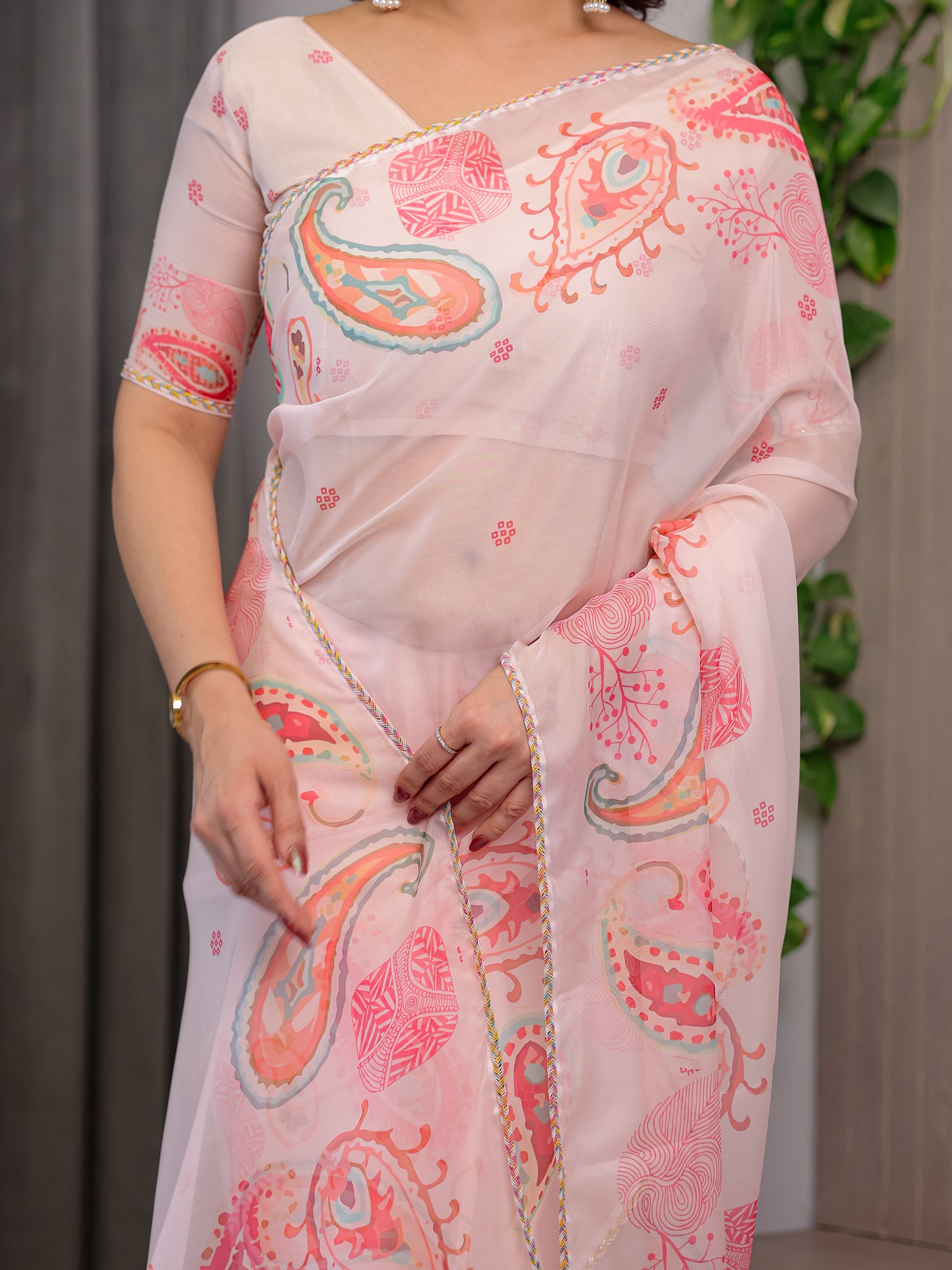 Pastel Peach Printed Organza Saree with Paisley Motifs & Multicolour Lace Border | Designer Lightweight Organza Saree with Attached Blouse Piece | Elegant Festive & Party Wear Saree