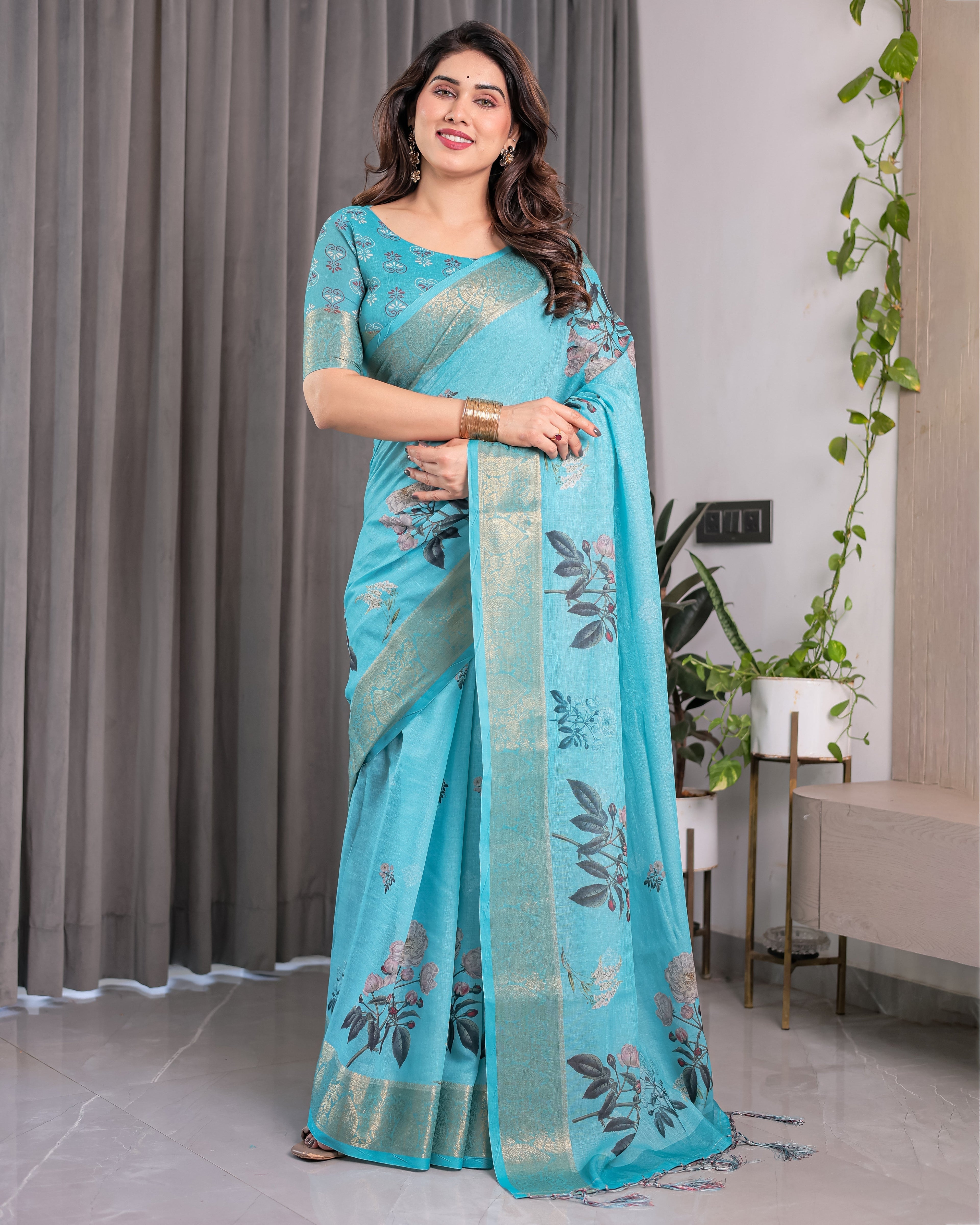Turquoise Blue Handloom Linen Saree with Floral Digital Print & Golden Zari Border | Tassel Detailing | Attached Blouse | 5.5m Saree + 0.8m Blouse