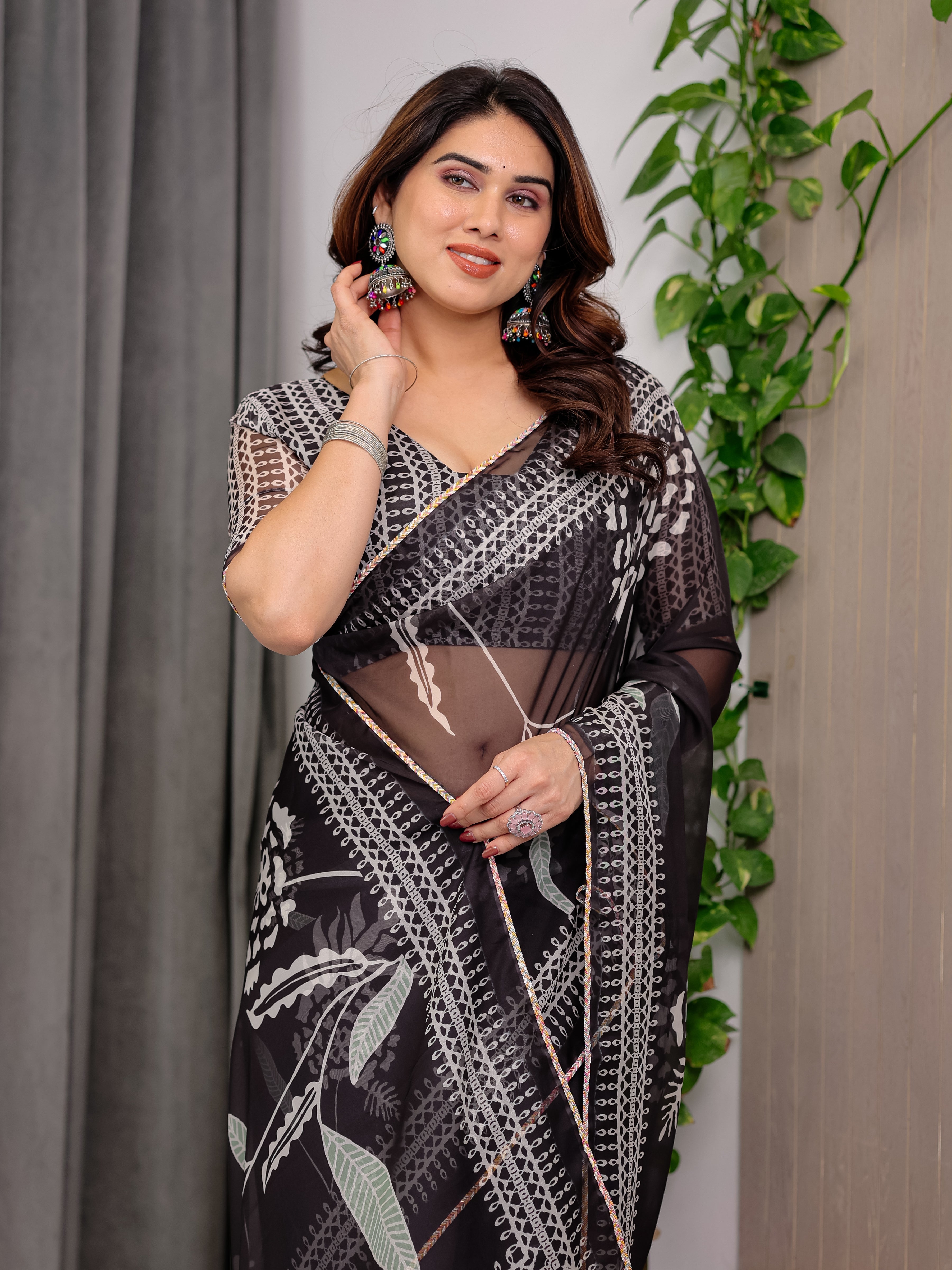 Elegant Black Floral Printed Organza Saree with Intricate Ethnic Border & Multicolour Lace Edges | Lightweight Designer Organza Saree with Attached Blouse Piece | Festive & Party Wear Saree