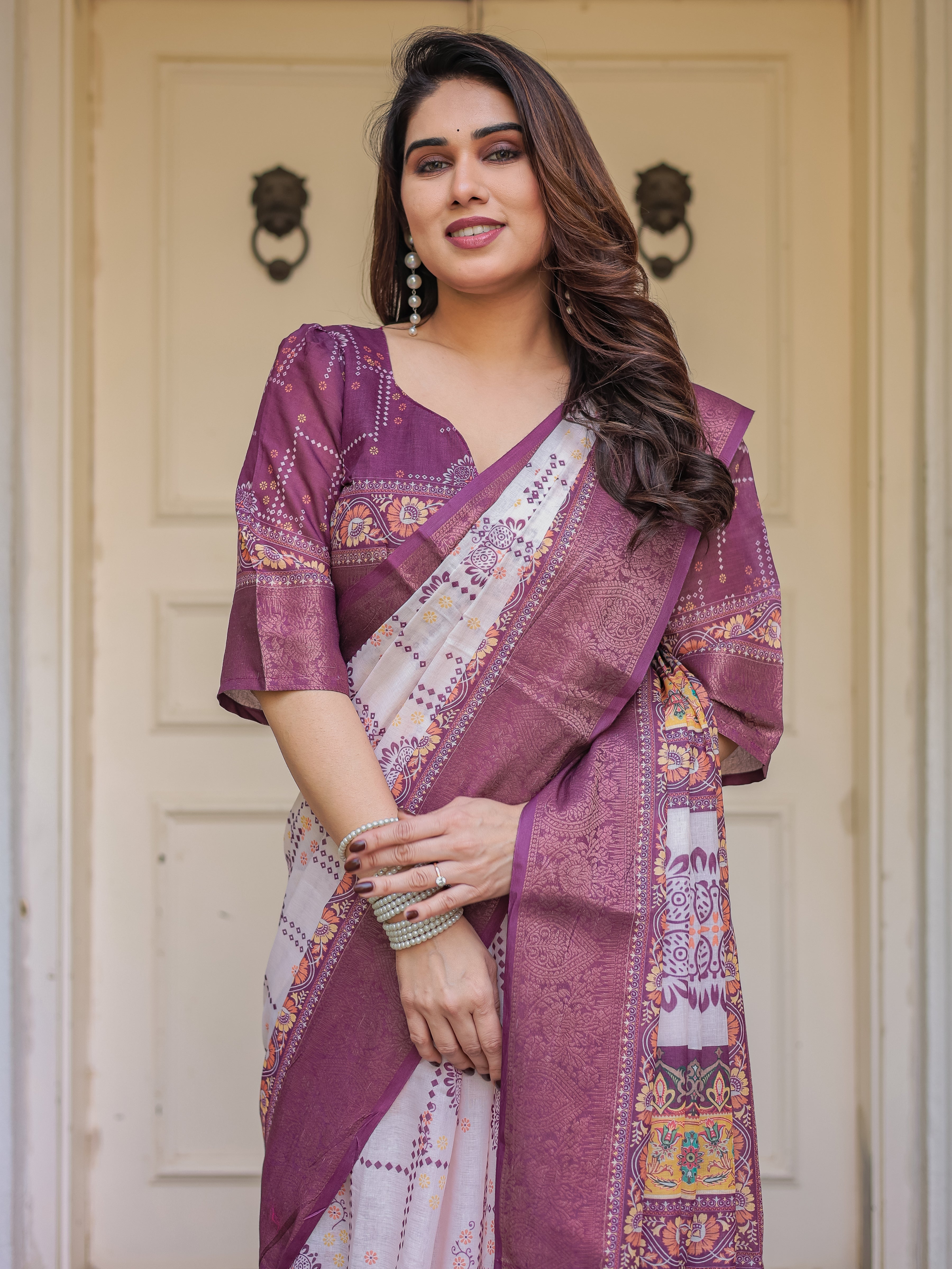Wine Purple Handloom Cotton Printed Saree with Floral Panel Pallu, Ornamental Border & Tassels – Festive Ethnic Wear