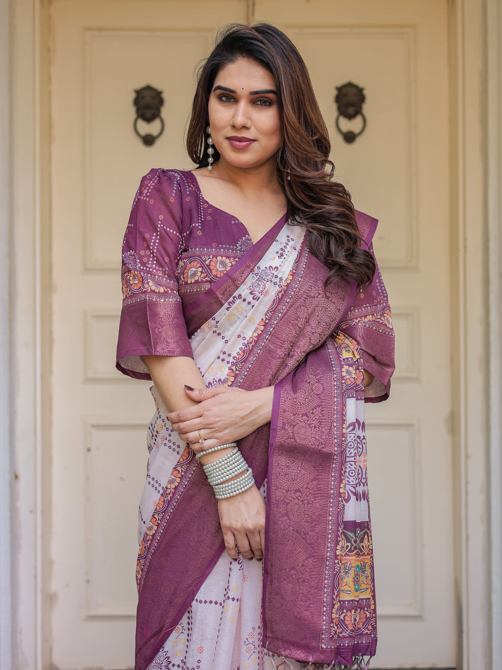 Wine Purple Handloom Cotton Printed Saree with Floral Panel Pallu, Ornamental Border & Tassels – Festive Ethnic Wear